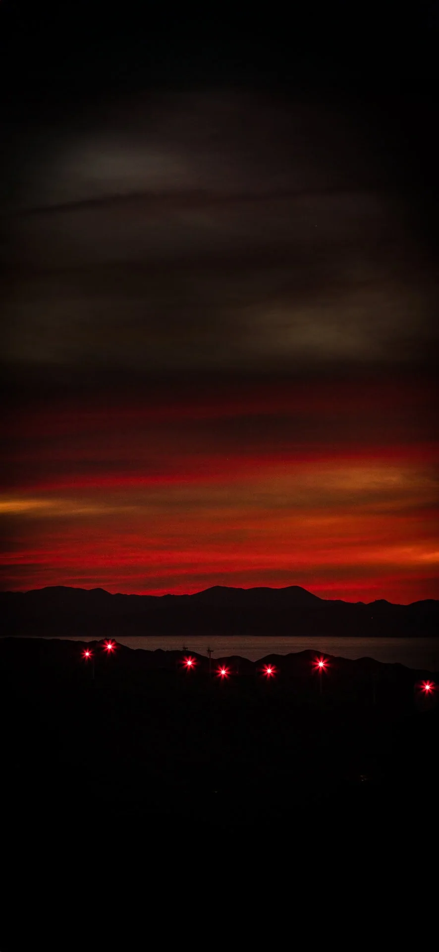   Sunset over South Island with lights from West Wind turbines 