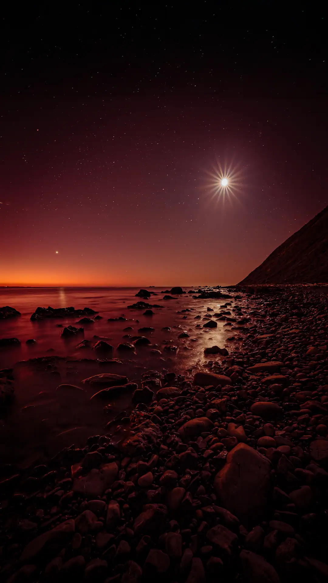  Venus and the Moon reflected in the  calm sea beside the Makara Walkway after sunset 