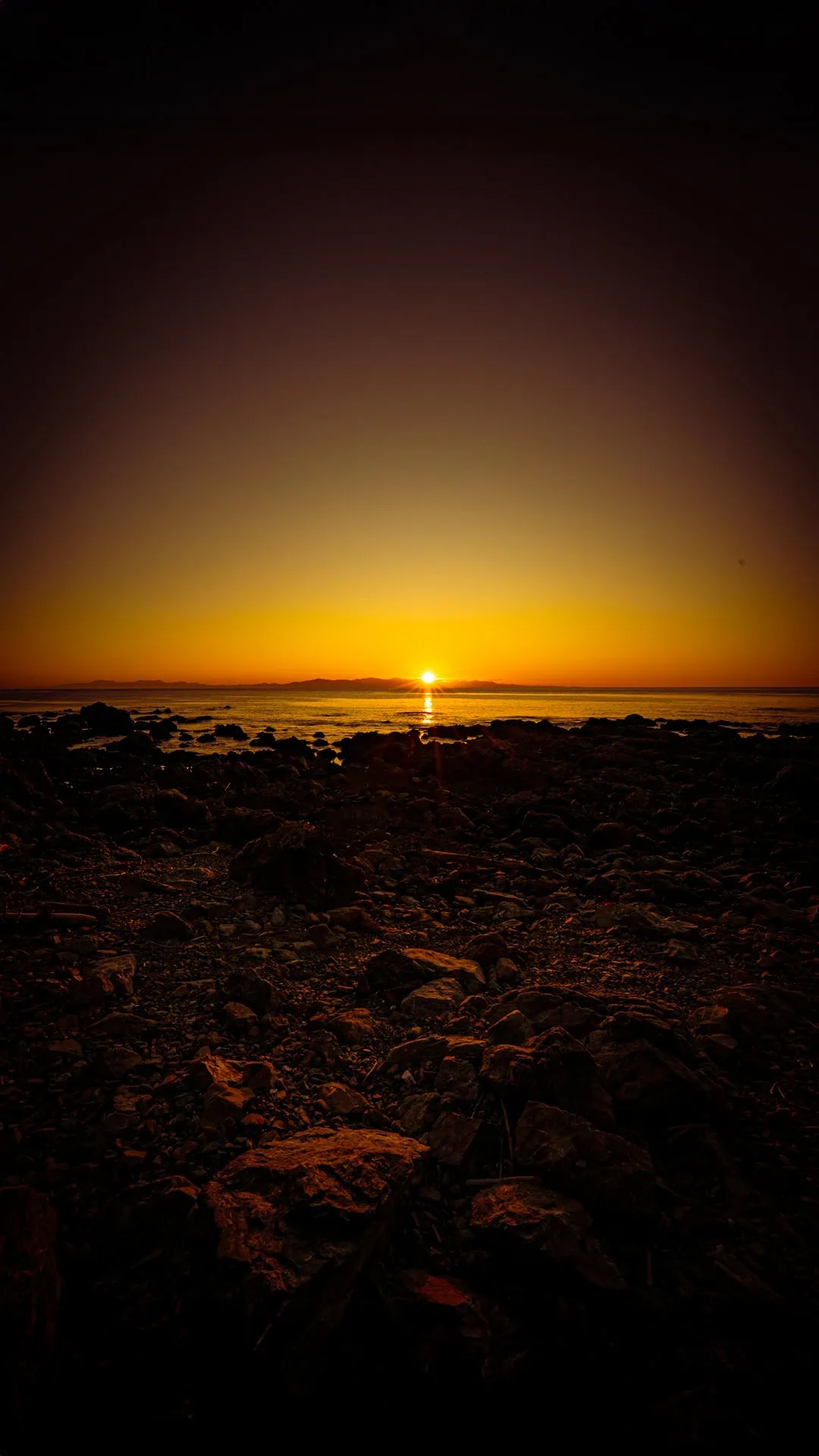  The sun sets over South Island viewed from the Makara Walkway 