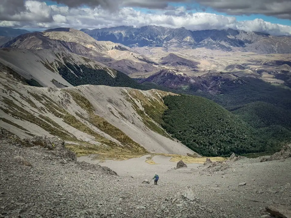 Descending scree slopes towards the Camp Saddle Track