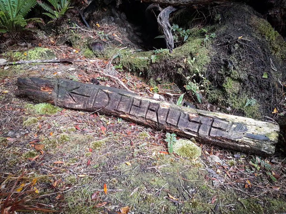 A crafted sign pointing to Diprose Bay