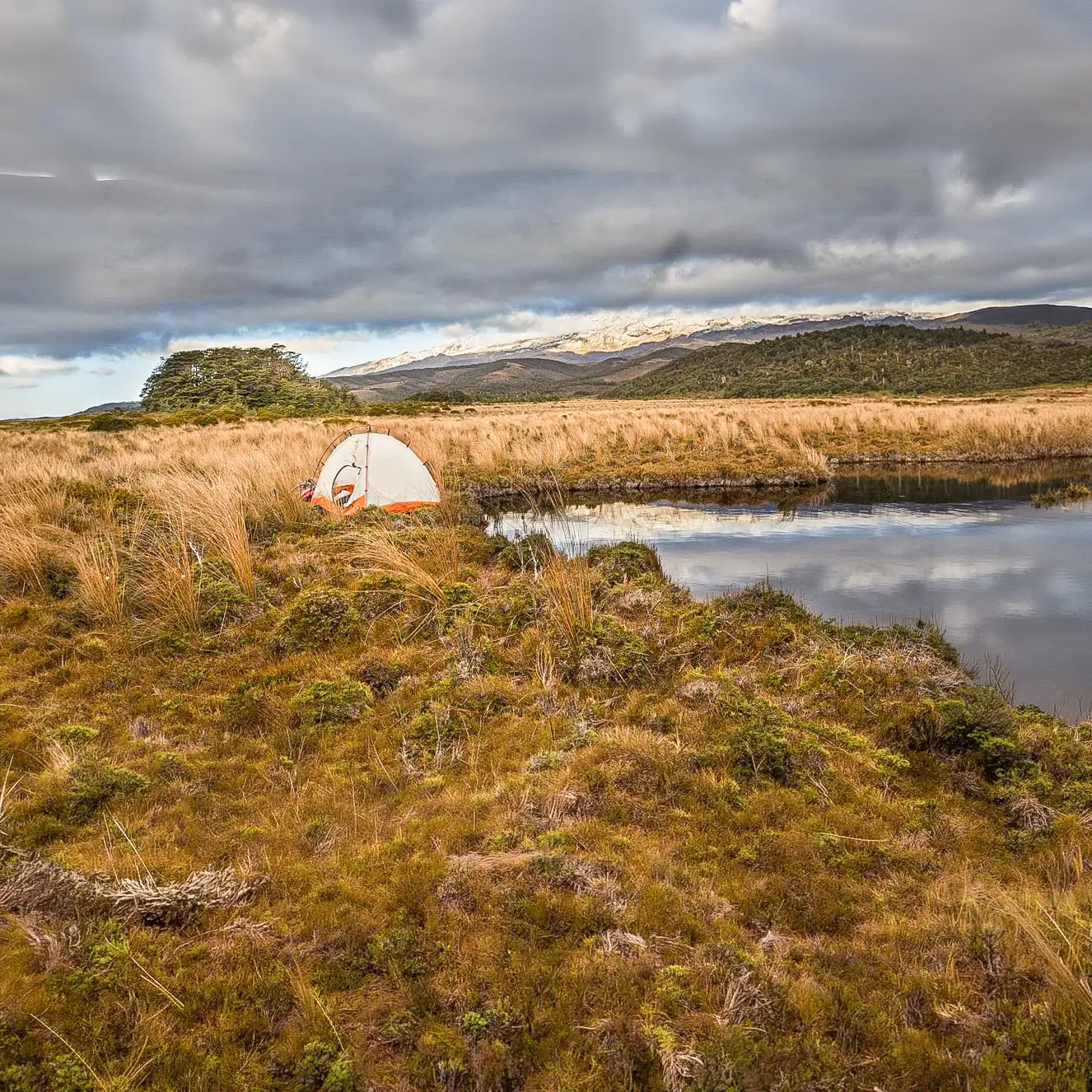 Camping by one of the many tarns with Mt Ruapehu in the background