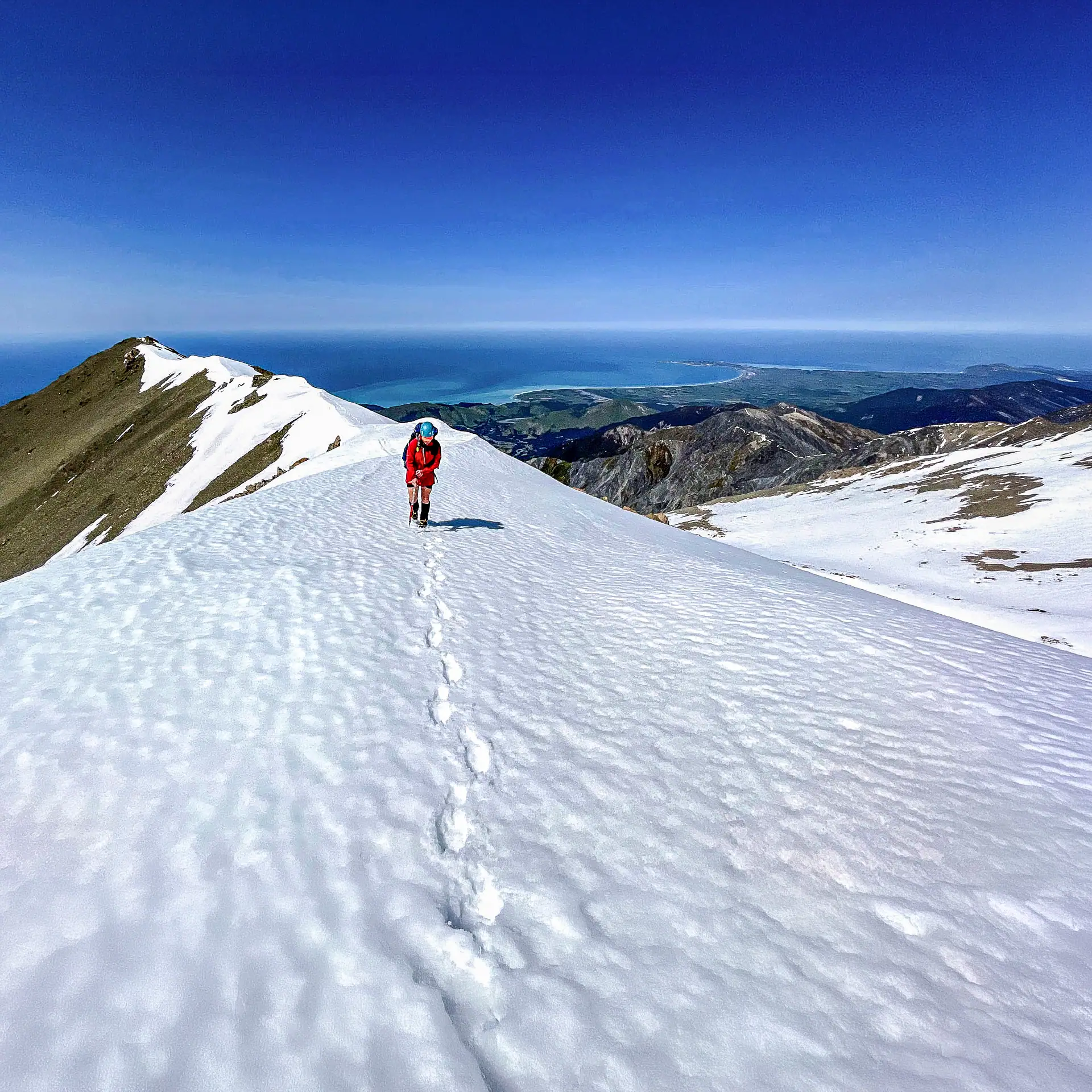 Hiker on the final ridge to the summit of Te Ao Whekere