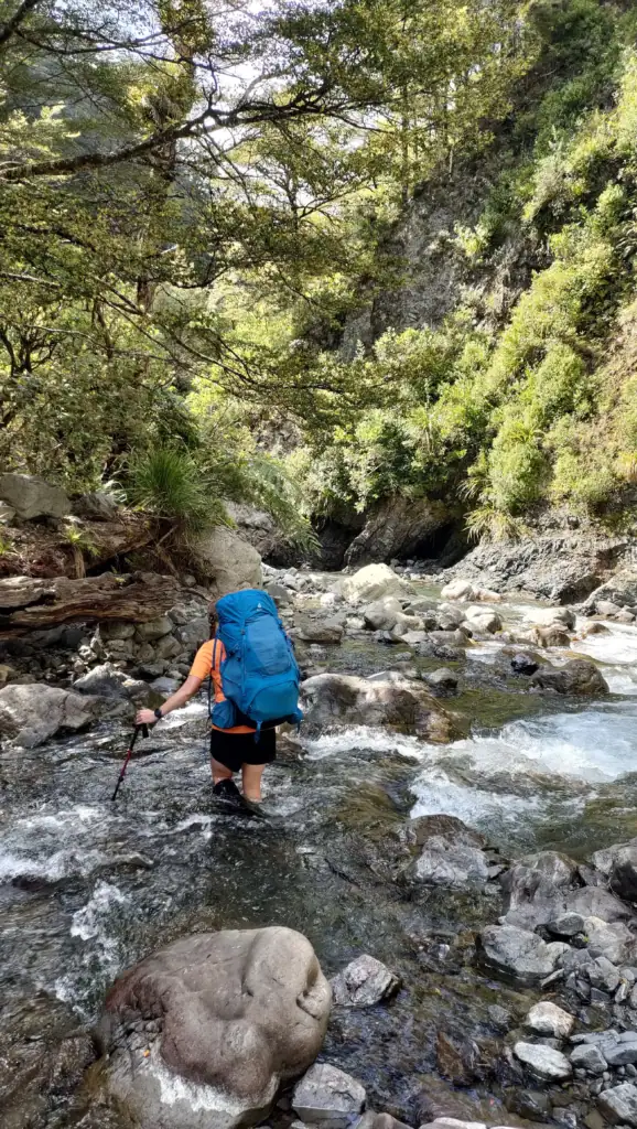 Sarah heading down the Tukituki River from Daphne Hut