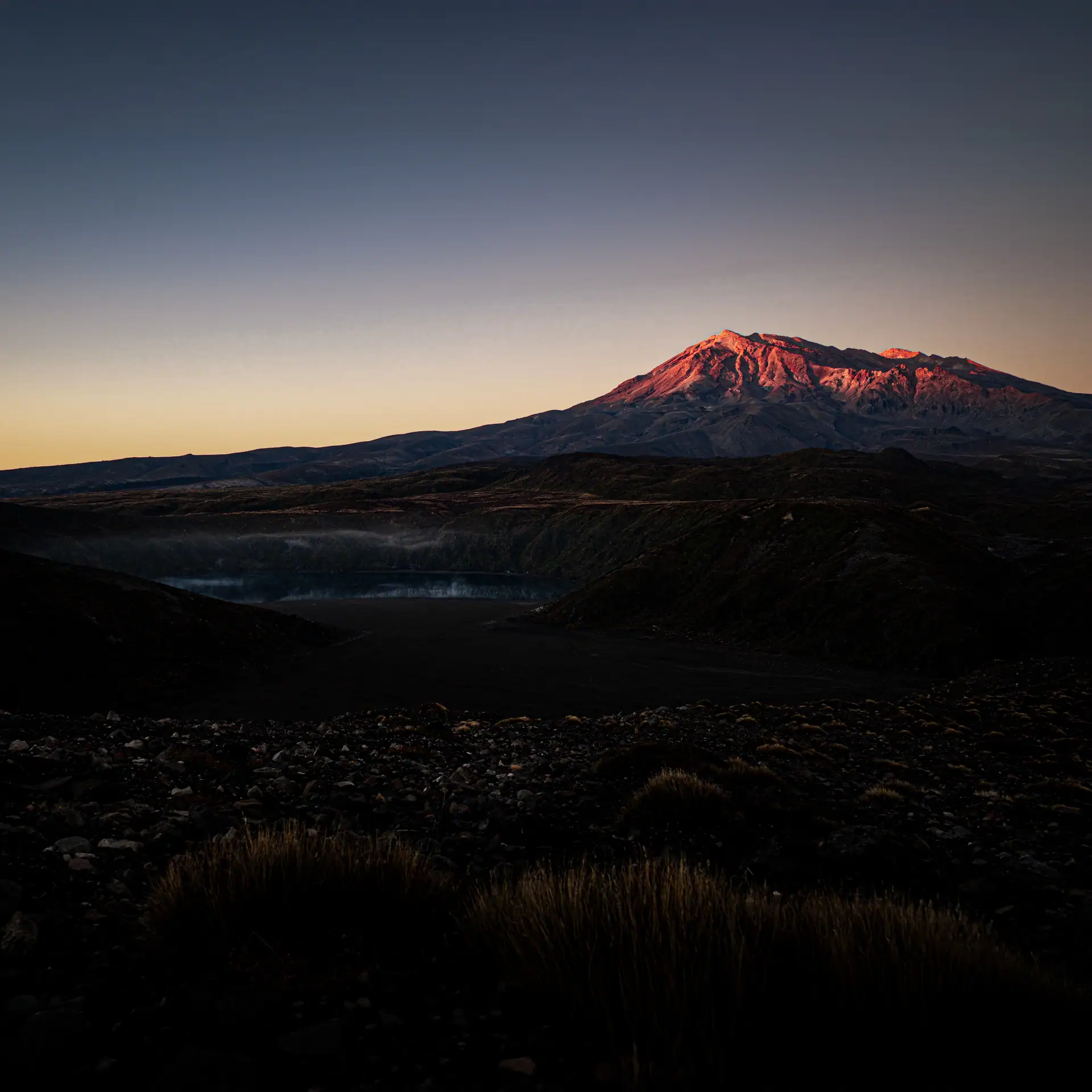 First light on the summit of Mt Ruapehu viewed at dawn from the Tama Lakes Track