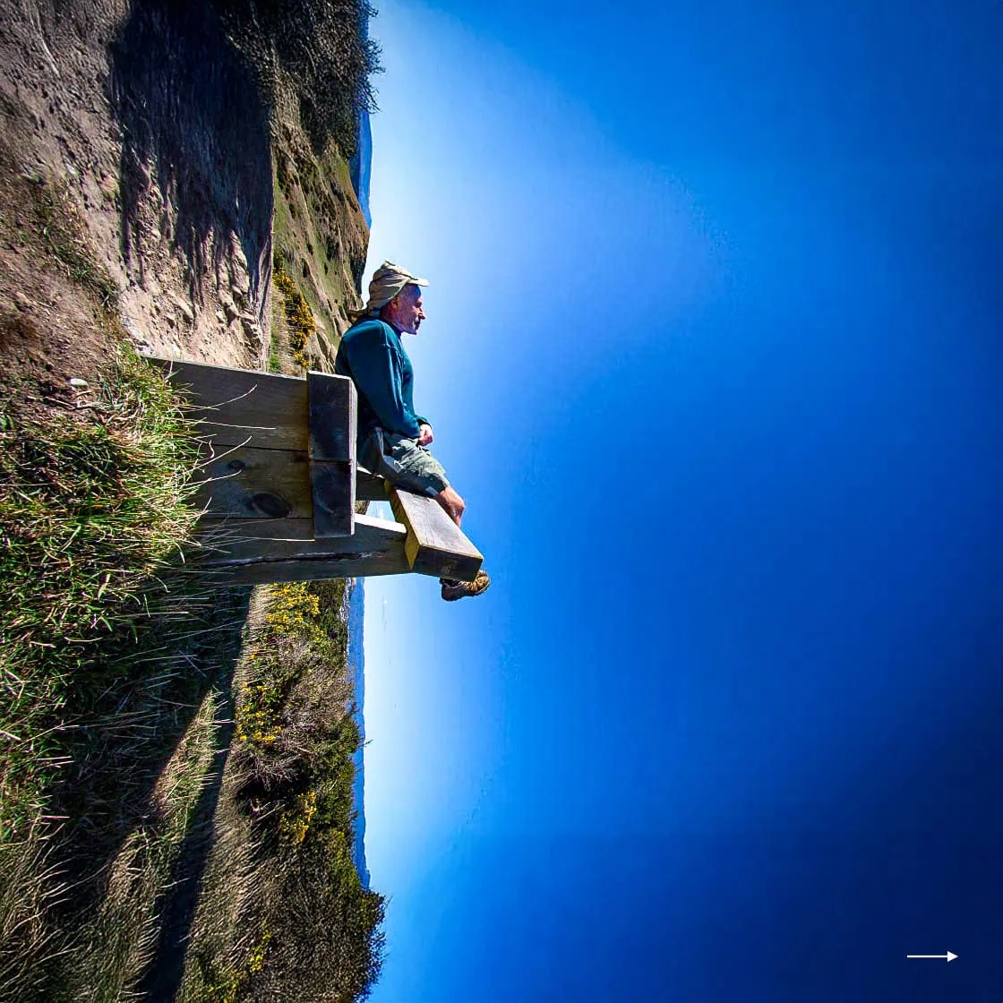 A trick photo to appear dramatic - person sitting on a seat on the edge of a void