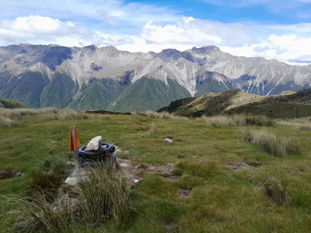 The loo with a view - open air thunderbox at Mt Misery Hut with a view across to the Travers Range