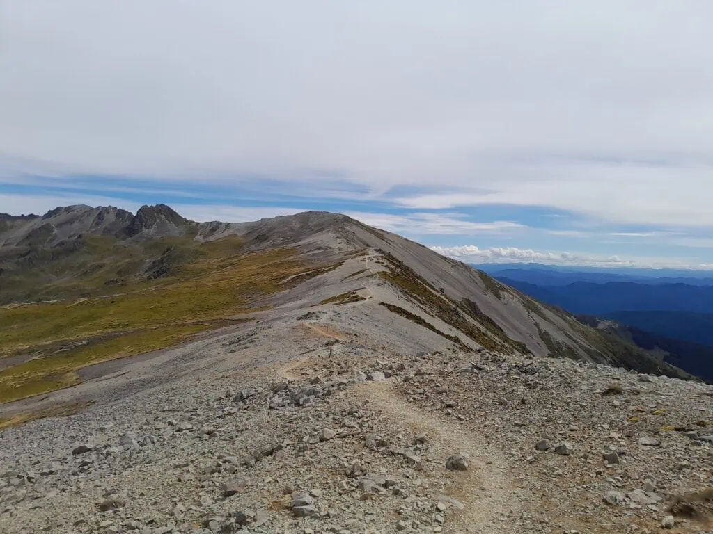 The broad Robert Ridge in Nelson Lakes National Park with scree slopes and alpine grass