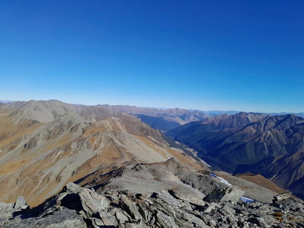 Dingle Burn Valley seen from the summit of Mt Gladwish in New Zealand. Panoramic view from the 1861-metre summit of Mt Gladwish looking over the rugged peaks of the Southern Alps.