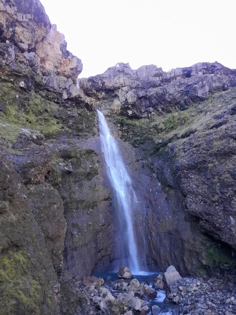 A massive 56-meter hidden waterfall near Mangaturuturu Hut, cascading down volcanic rock faces into the Mangaturuturu River in Tongariro National Park