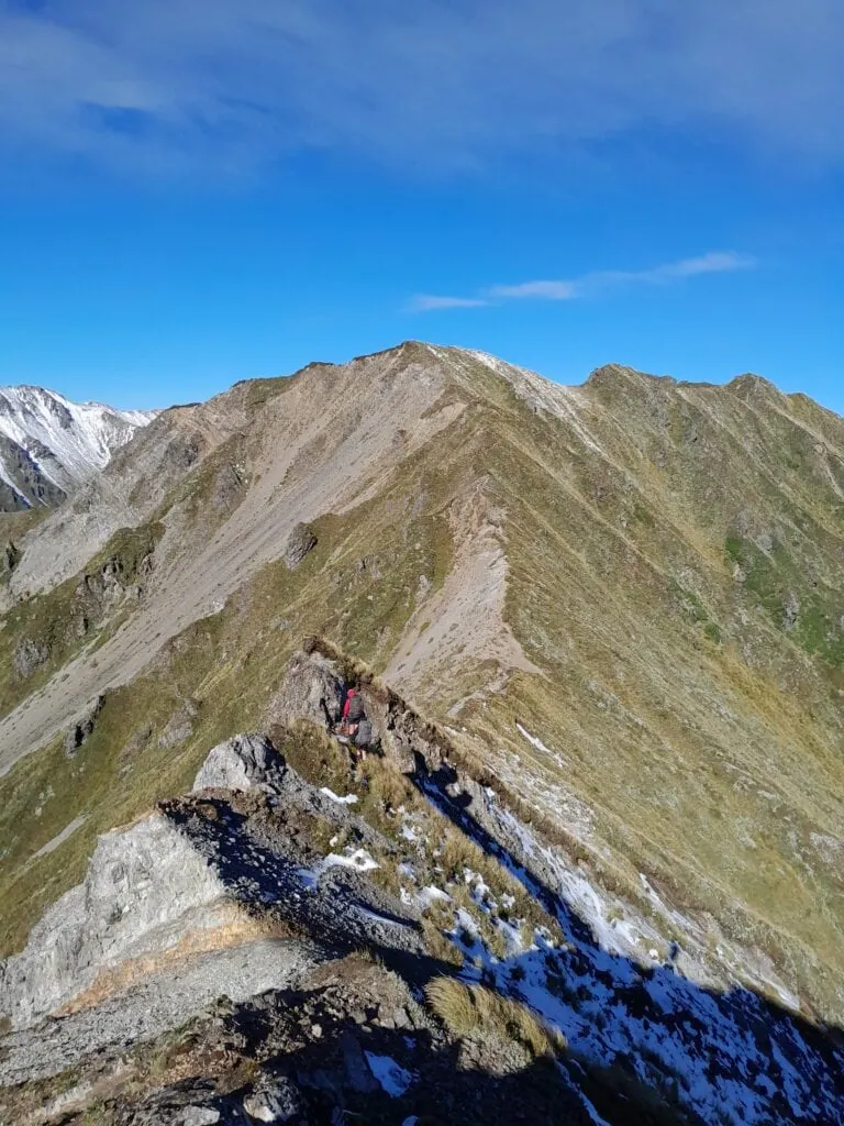 A very eroded ridgeline with some snow covering above Waterfall Hut in the Ruahine Range