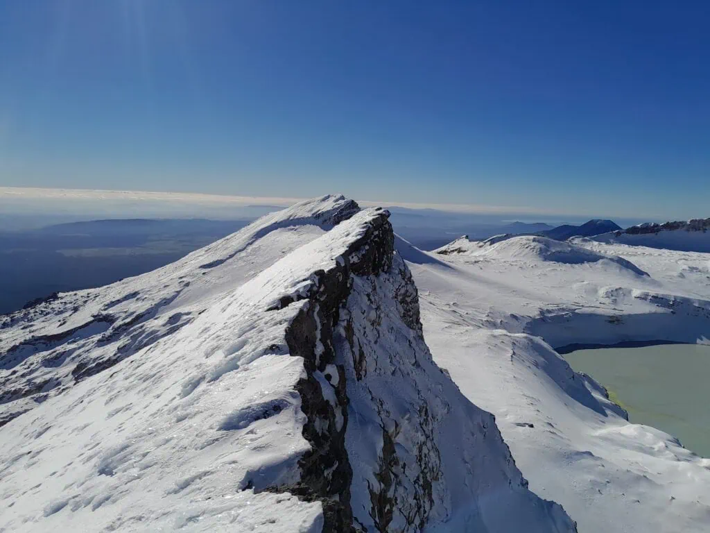 View of Paretetaitonga from the summit of Te Ātaahua (Point 2757), Mt Ruapehu in Tongariro National Park with part of the Ruapehu Crater Lake