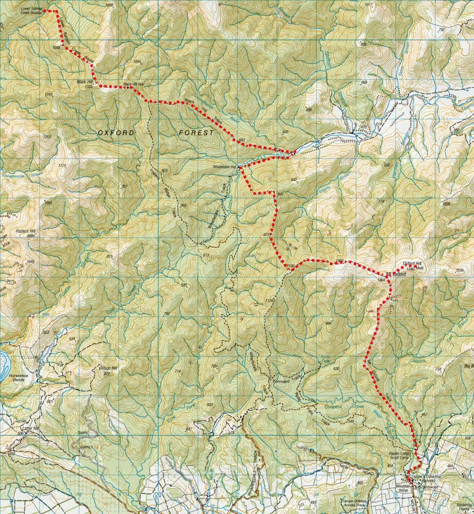 Topographic map of Oxford Forest showing a highlighted red tramping route connecting Mt Oxford, Wharfedale Hut, Black Hill, and Lower Salmon Creek Bivouac.