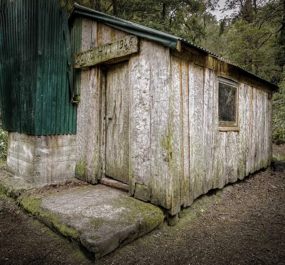 Cone Hut in the Tararua Range with the cladding showing axe marks of the hand felled timber.