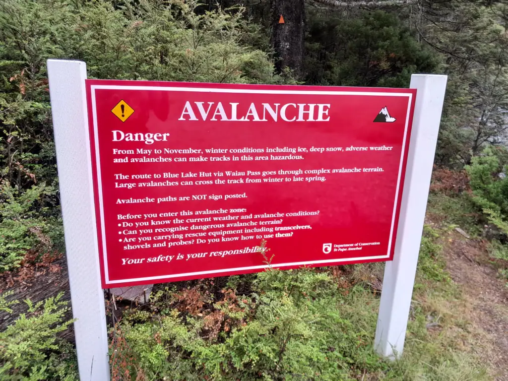 Red avalanche warning sign before Waiau Pass in Nelson Lakes National Park