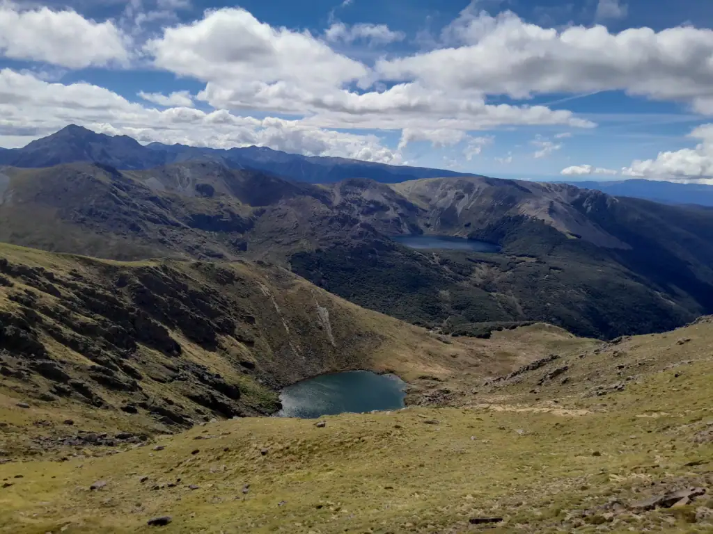 High-angle mountain view looking down into the basin containing Lake Lillie along the Lake Sylvester & Lake Lockett Loop route.