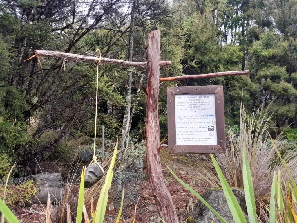 Lake Rotoiti Weather Stone sign in St Arnaud detailing funny rules for forecasting weather in Nelson Lakes National Park.