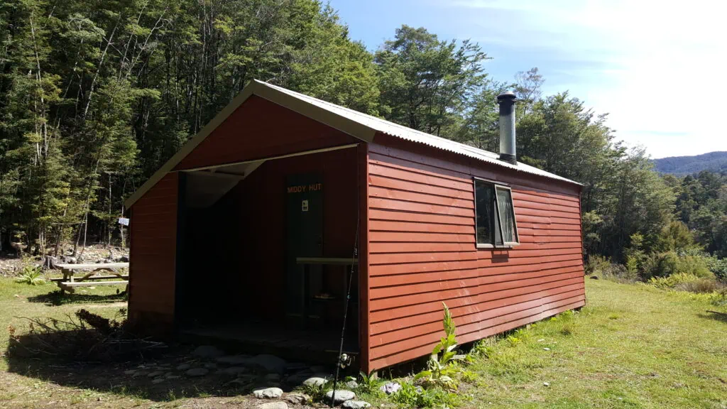 Red Department of Conservation (DOC) Middy Hut on the Pelorus Track in Richmond Forest Park, Marlborough