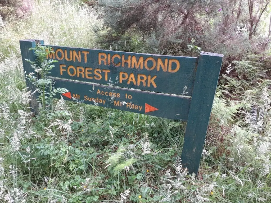 Mount Richmond Forest Park wooden directional sign marking access to Mt Sunday and Mt Riley tracks., Marlborough