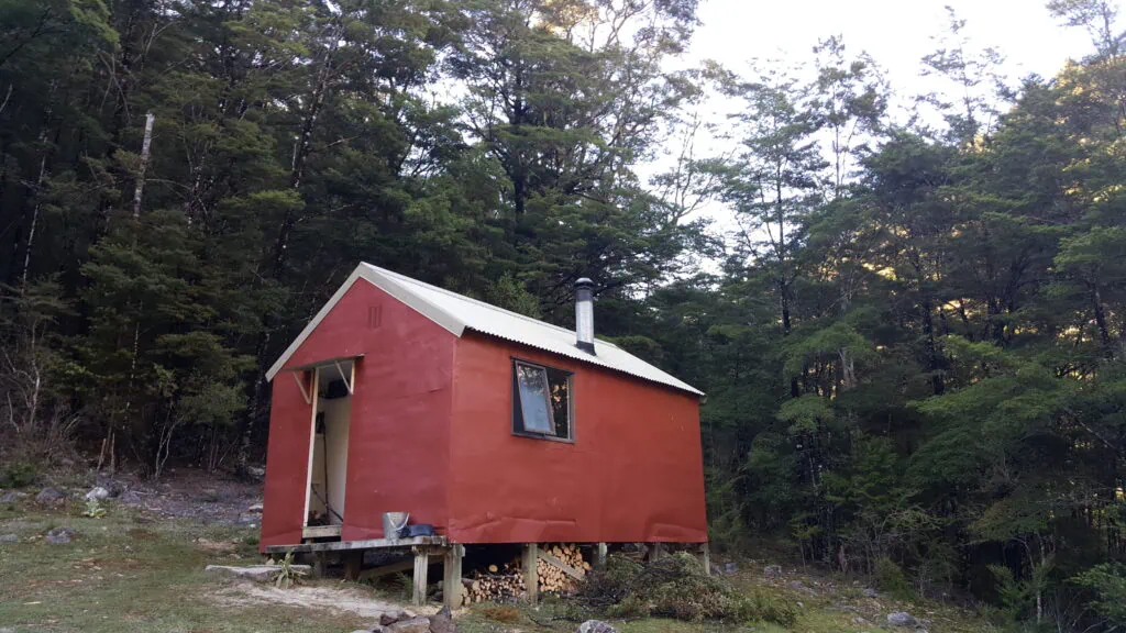 The remote red-clad Roebuck Hut along the Pelorus Track in Mt Richmond Forest Park, Marlborough