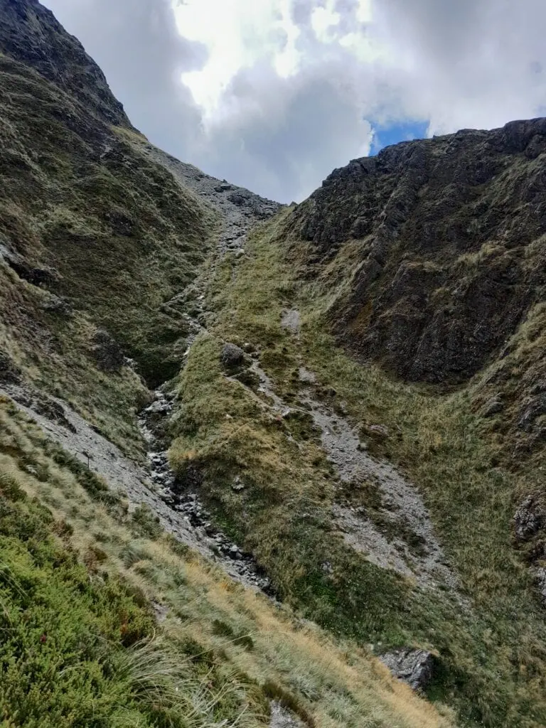 Steep, rocky gully track along the west side bypass of Lake Constance on the Waiau Pass route, Nelson Lakes National Park