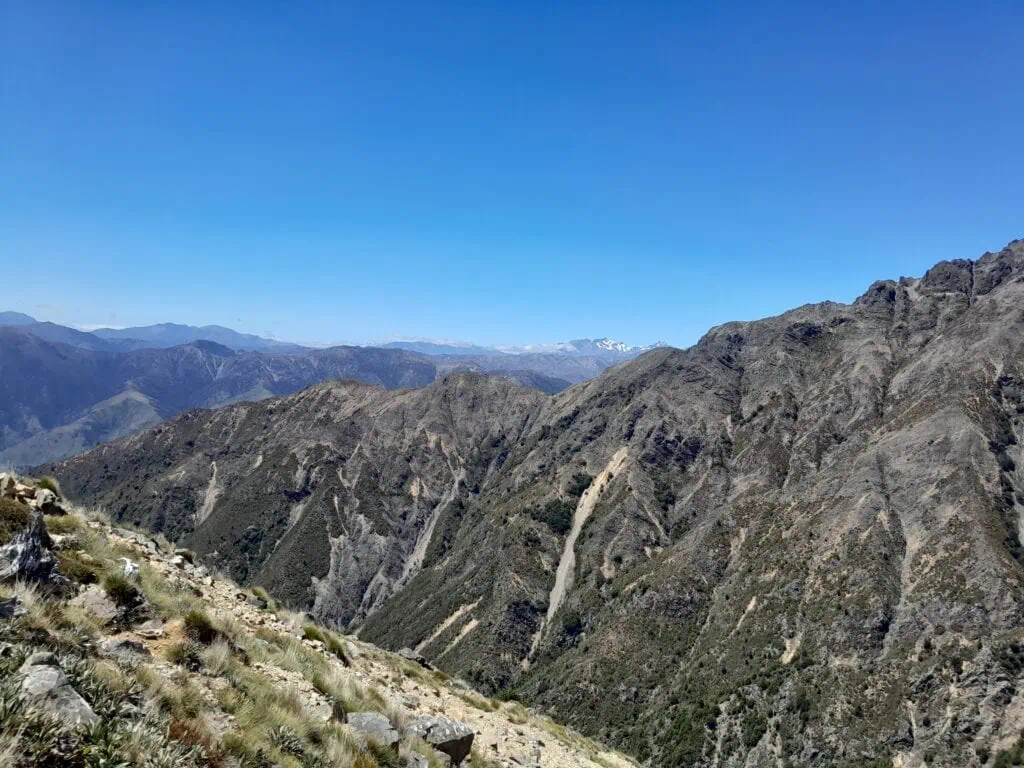 Scenic mountain view overlooking deep valleys in the Raglan Range with Snow dusted Tapuae-o-Uenuku Peak, Inland Kaikōura Range